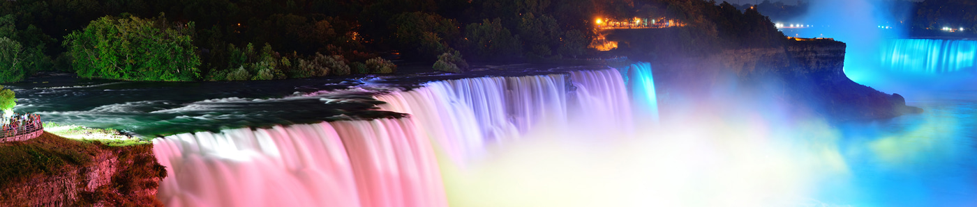 View an image of niagara falls in lights that resemble neon lights containing xenon gas.